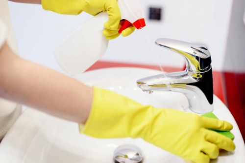 Cleaning professional preparing a service area before a scheduled appointment