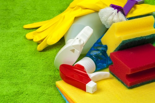 Team member following safe cleaning practices in a workplace
